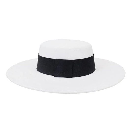 White derby fedora hat with flat wide brim and black ribbon band on white background