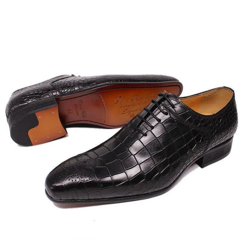 Men's black crocodile pattern leather dress shoes with lace-up design on white background