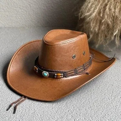Faux leather western cowboy hat with decorative band on a textured surface