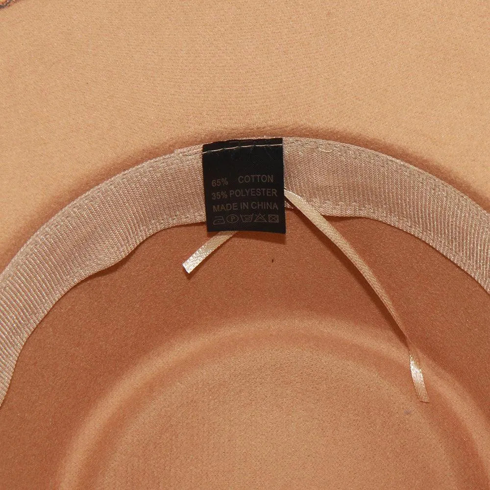 Close-up of beige fedora hat interior with care tag, cotton polyester blend label.