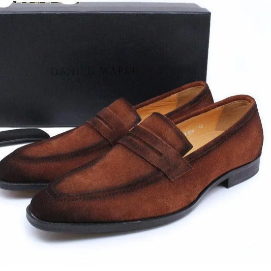 Brown suede men's dress loafer shoes with black soles on white background