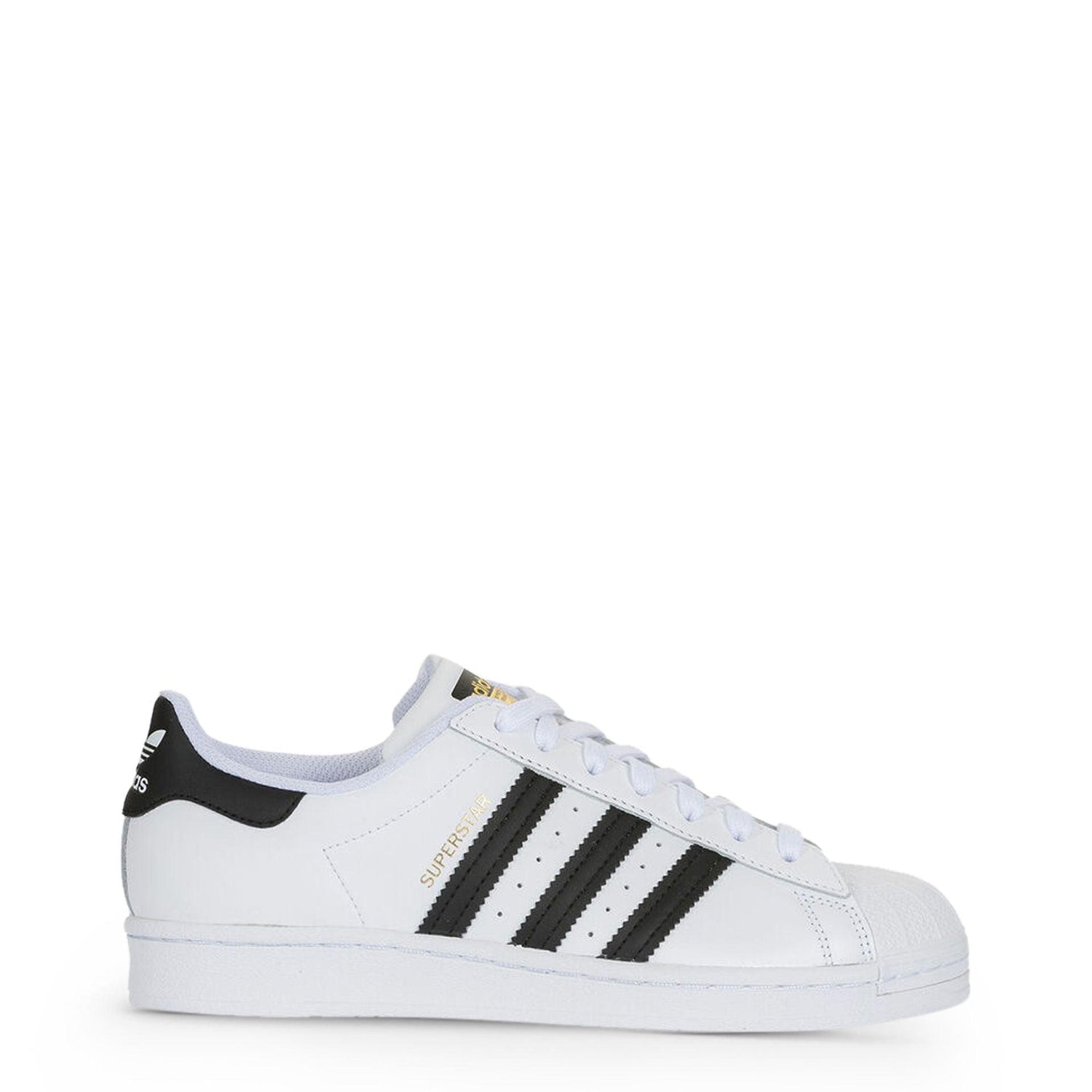 White Adidas Superstar sneaker with black stripes and gold text on a plain background