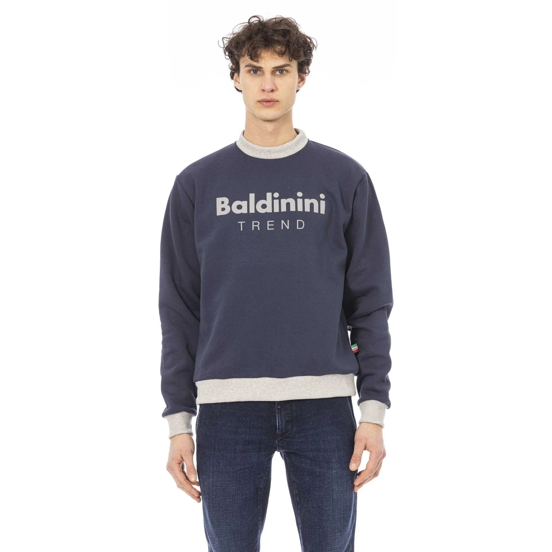 Man wearing Baldinini Trend navy sweatshirt and jeans, contemporary fashion by GUOCALI Paris