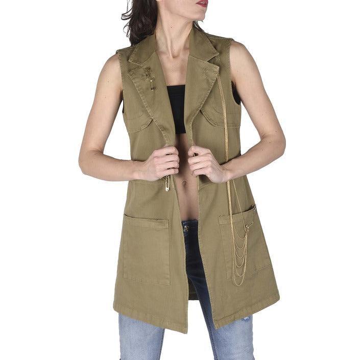 Woman wearing khaki sleeveless vest with large pockets and chain detail, casual fashion