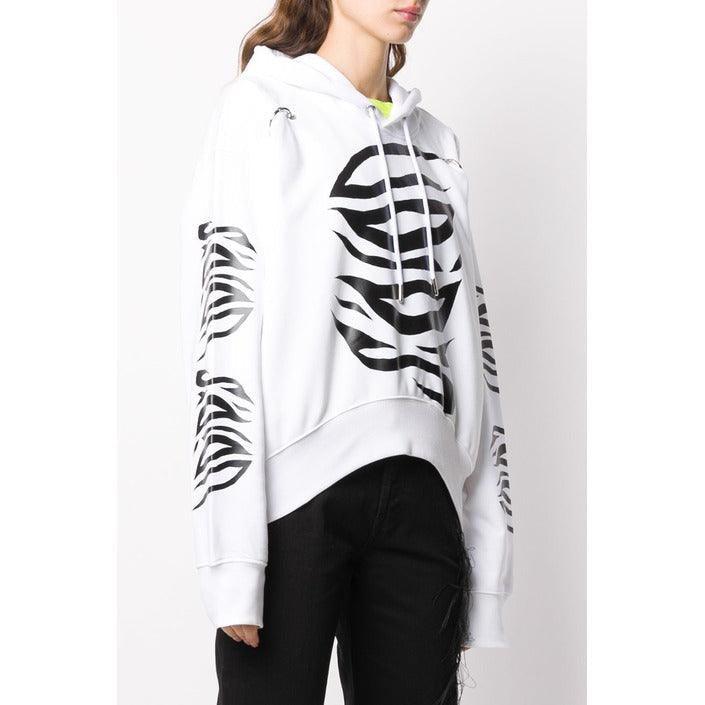 Woman wearing white hoodie with black zebra print, black pants, All Seasons Collection