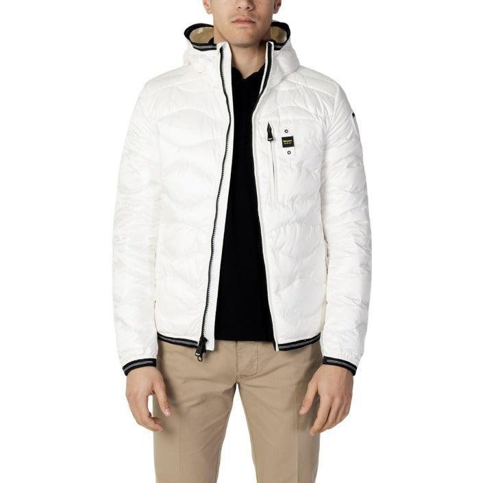 Man wearing a white puffer jacket with hood, beige pants, and a black shirt