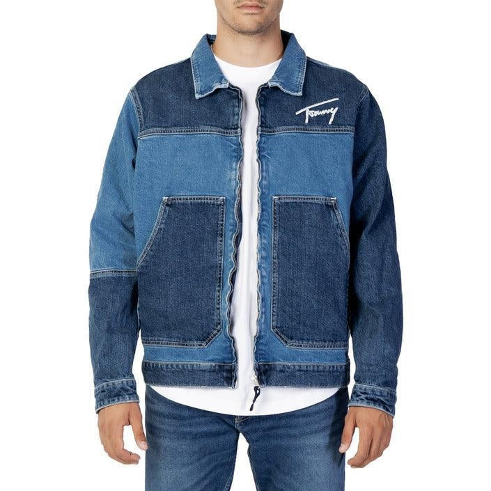 Man wearing a blue denim jacket with large front pockets and white logo, casual style