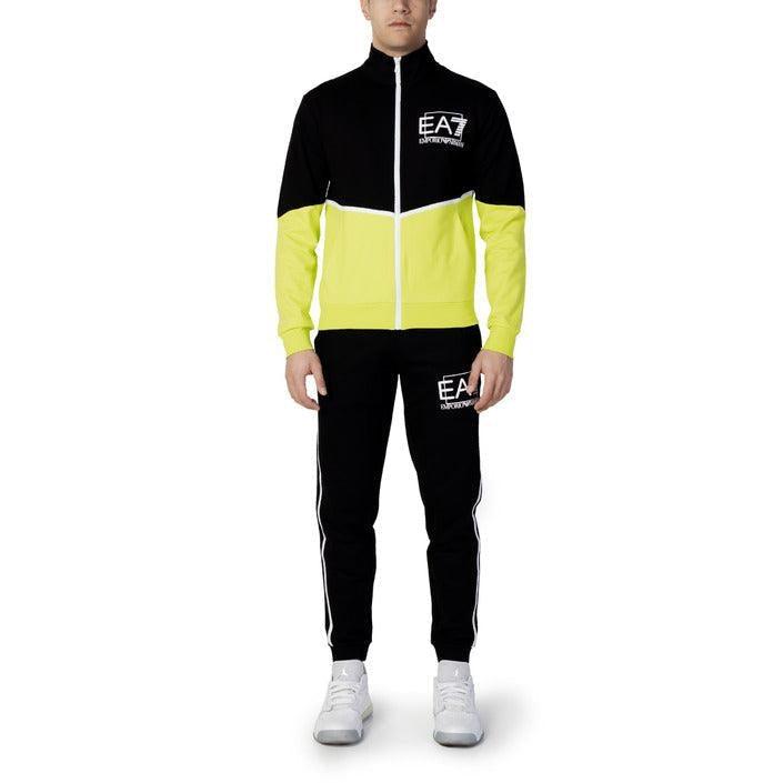 Man wearing black and yellow EA7 Emporio Armani men's tracksuit with white sneakers
