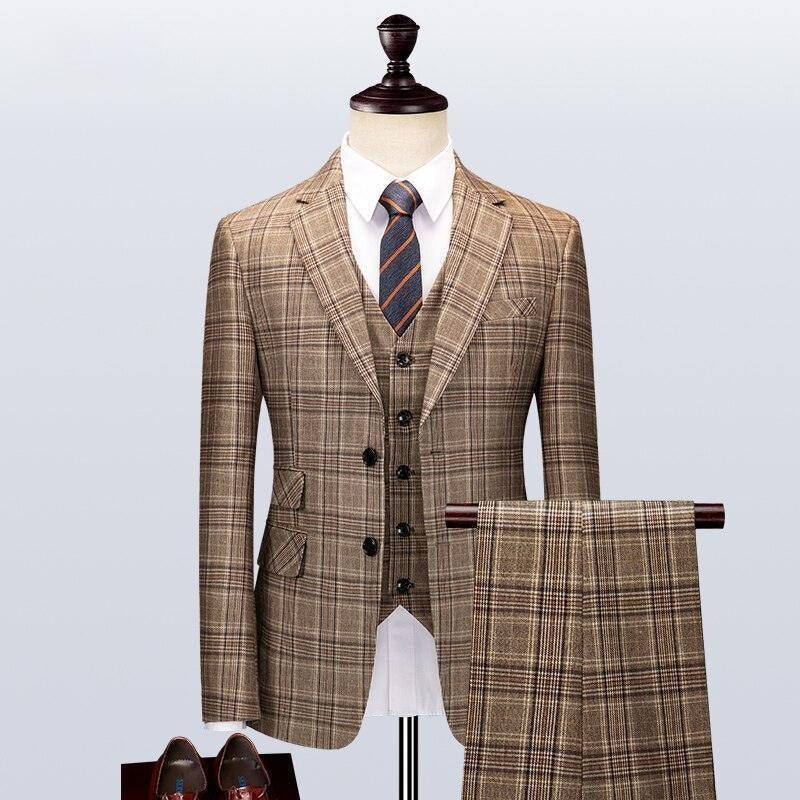 Men's plaid three-piece suit with matching tie and shoes on display mannequin