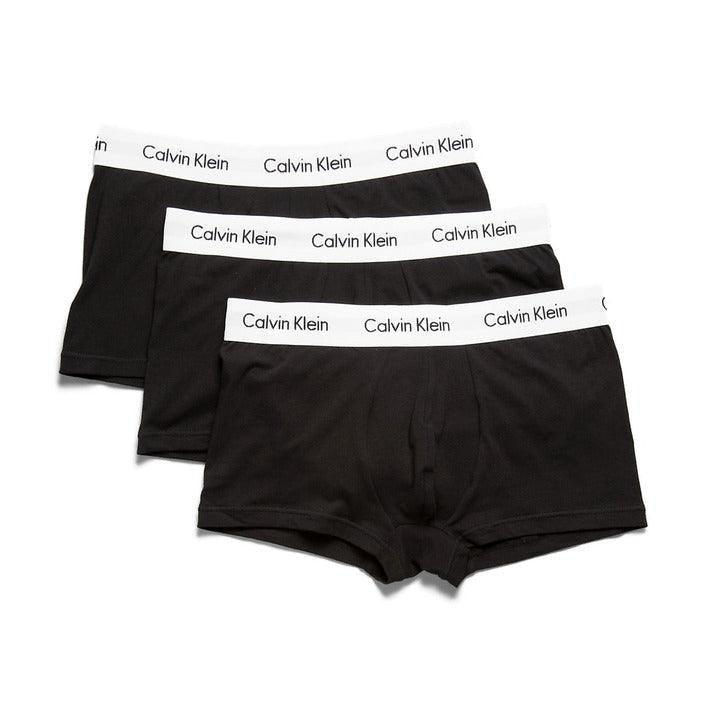 Three black Calvin Klein men's boxer briefs with white logo waistbands, stacked on white background