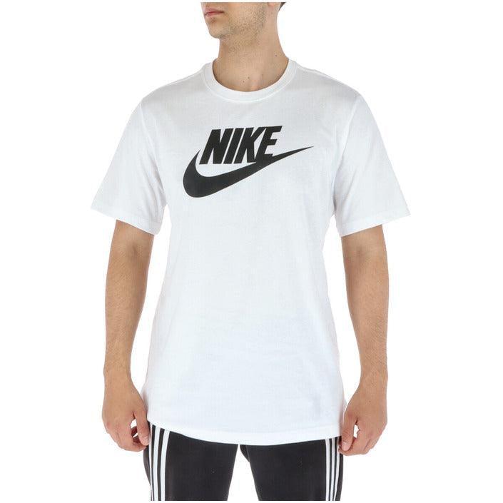 Man wearing white Nike logo t-shirt and black athletic pants with stripes