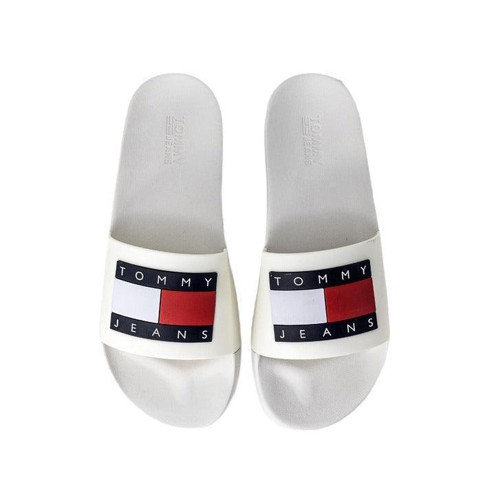 White Tommy Jeans slide sandals with red, white, and navy logo on the straps