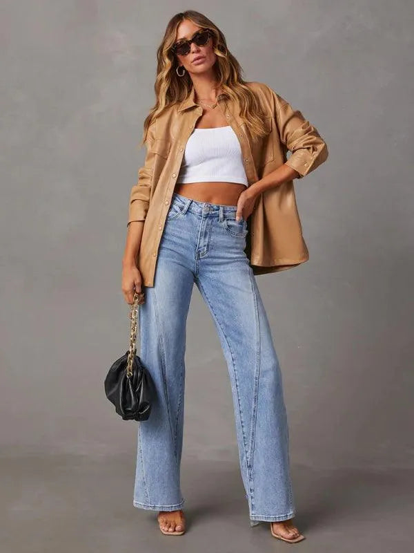 Woman wearing wide leg jeans, tan shirt, crop top and holding a black purse, fashion style