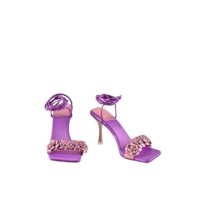 Purple women's high heel sandals with rose flower accents on white background