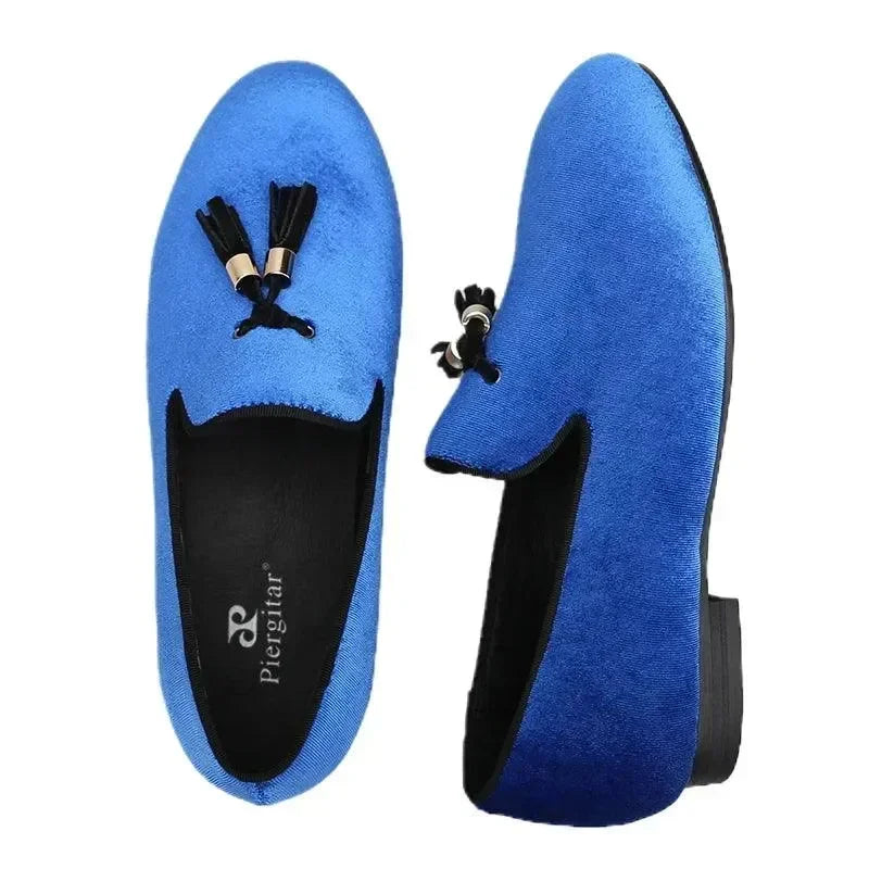 Pair of blue velvet kids loafers with black tassels fashion image