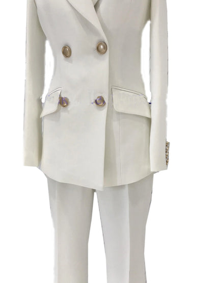 White double-breasted pant suit with bell-bottoms and gold buttons, on mannequin