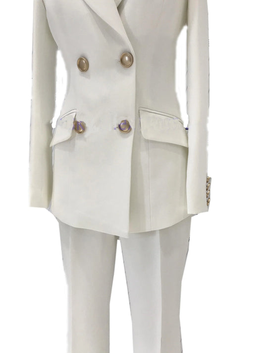 White double-breasted pant suit with bell-bottoms and gold buttons, on mannequin
