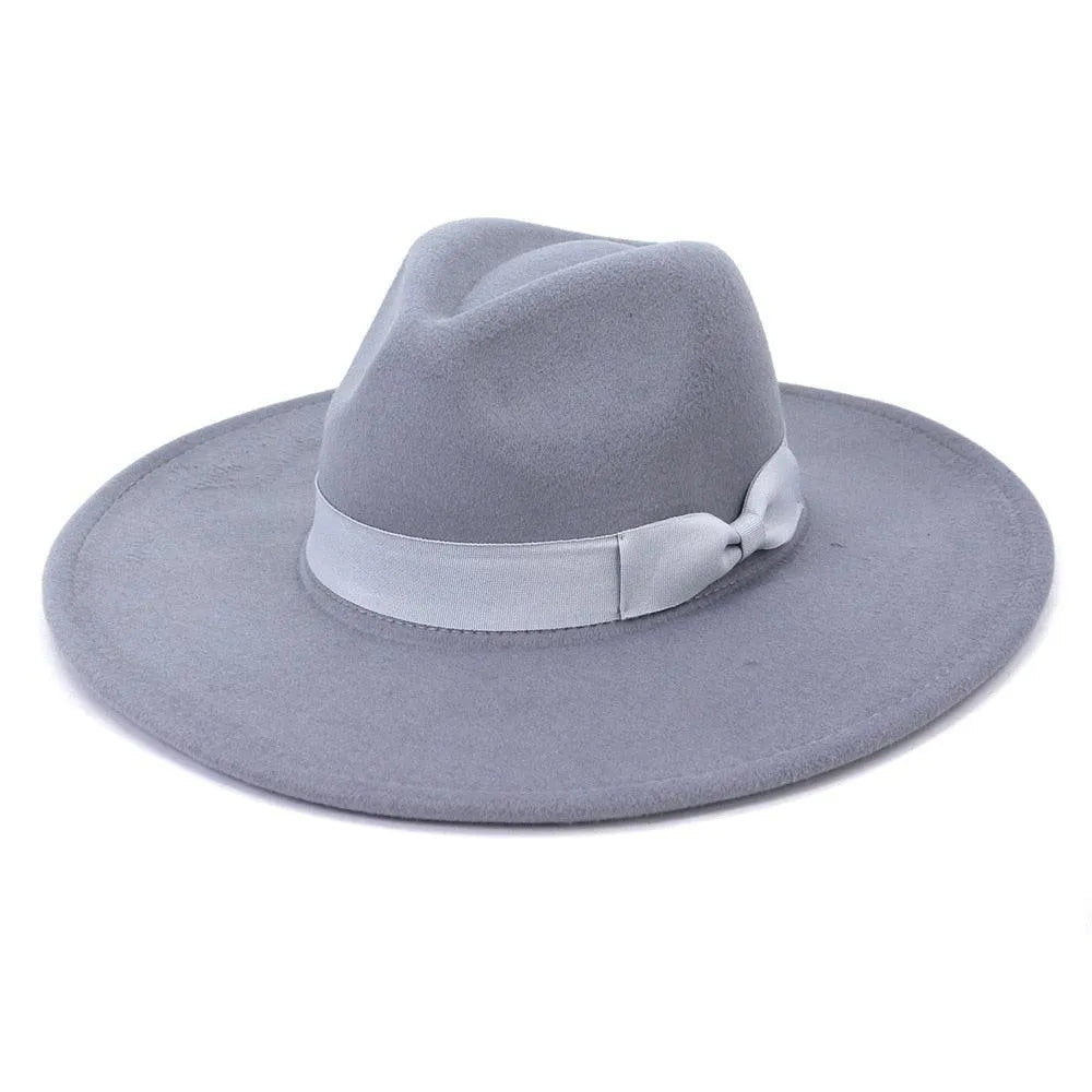 Wide brim light grey retro fedora hat with ribbon band on white background