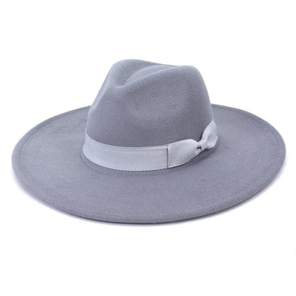 Wide brim light grey retro fedora hat with ribbon band on white background