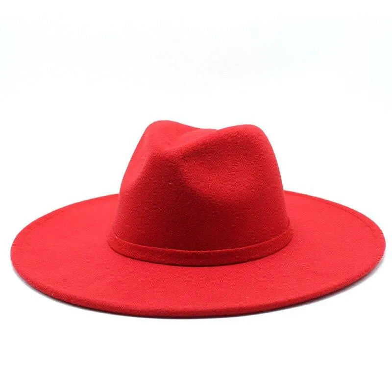 Bright red British style fedora hat with wide brim on a white background