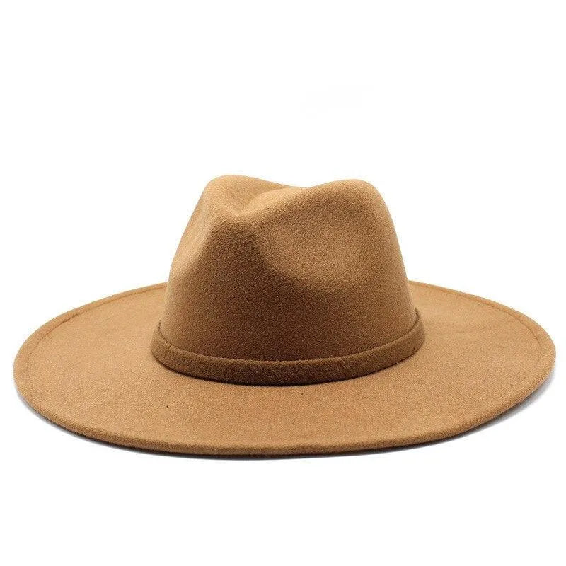Tan British style fedora hat with wide brim on a white background