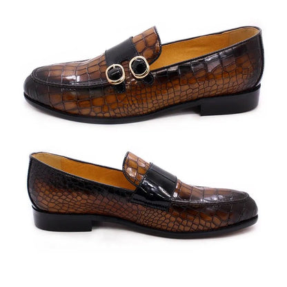 Brown crocodile pattern men's dress loafers with gold buckles on white background