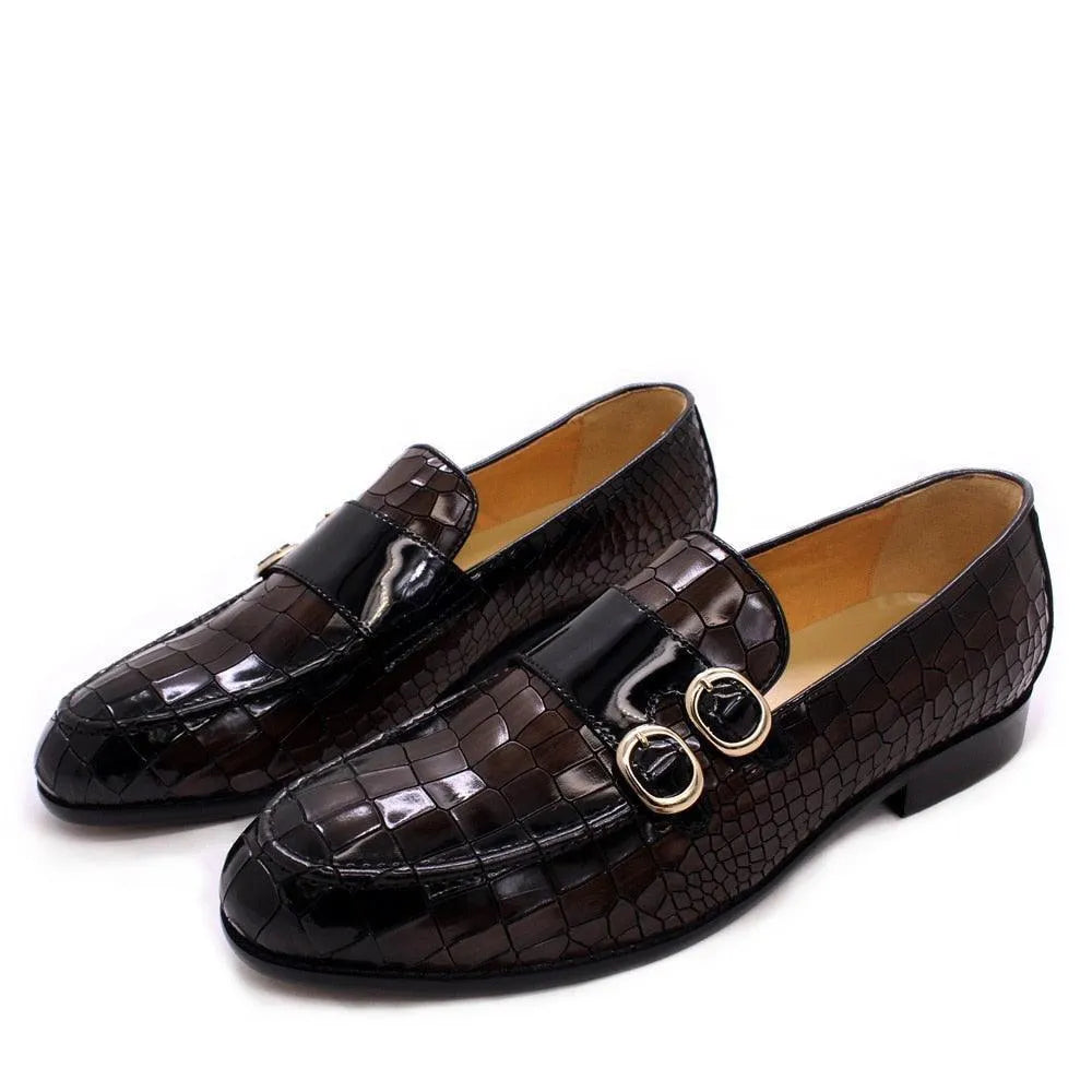 Men's black crocodile pattern dress loafers with gold buckle detail on white background