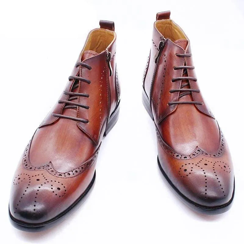 Brown formal leather ankle boots with brogue detailing on white background