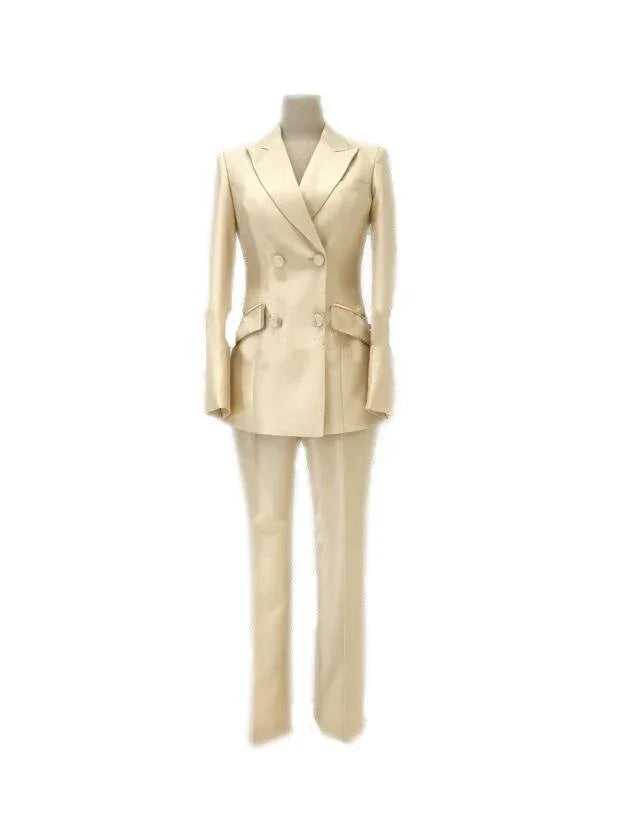 Beige double-breasted women's business pantsuit with blazer and trousers on mannequin