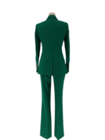 Back view of a green double-breasted women's formal pantsuit on a mannequin