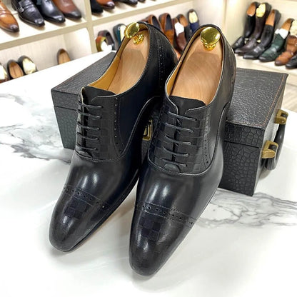 Black leather men's dress shoes with lace-up design on a marble table, shoe rack in background