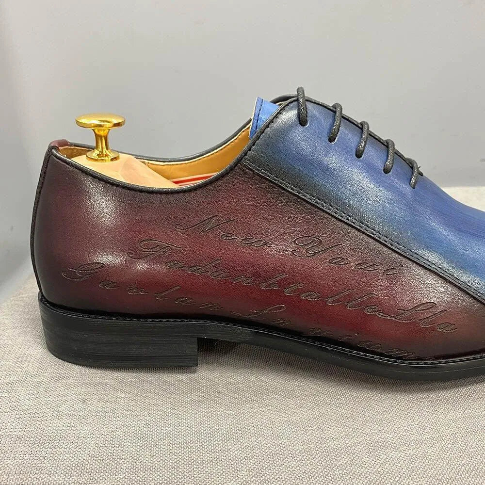 Men's color block dress shoe in blue and burgundy leather with engraved script detail
