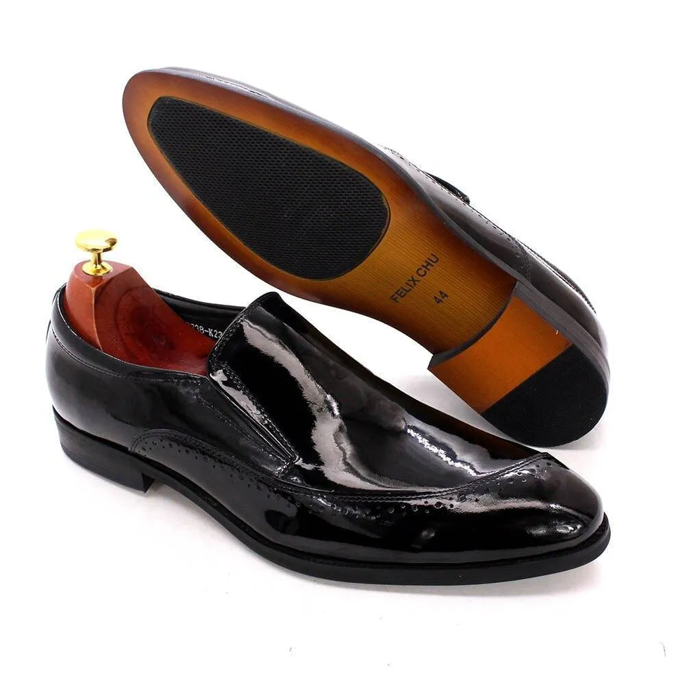 Black glossy men's slip-on dress shoes with leather soles on a white background