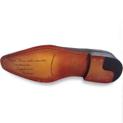 Brown leather men's dress shoe sole with engraved script and black heel cap