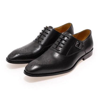 Black classic leather men's dress shoes with brogue detailing and buckle accent