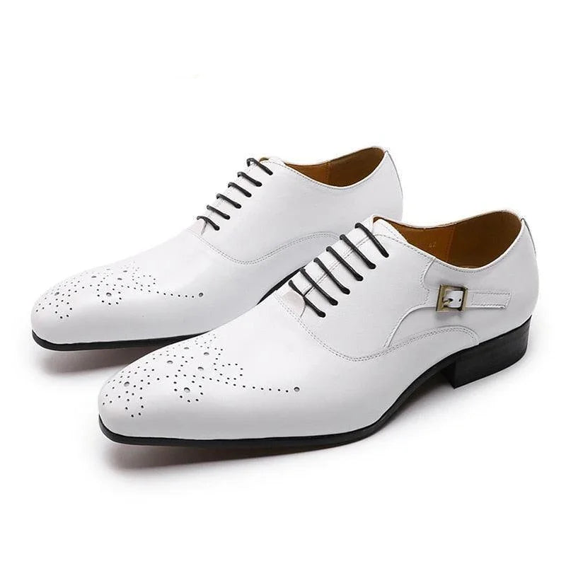 White men's dress shoes with lace-up design, brogue detailing, and decorative buckle