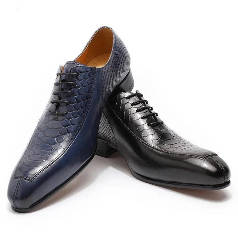 Men's dress shoes in blue and black with lizard pattern leather, lace-up style, on white background.