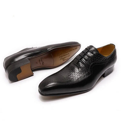 Black pointed toe men's dress shoes with textured leather pattern on white background
