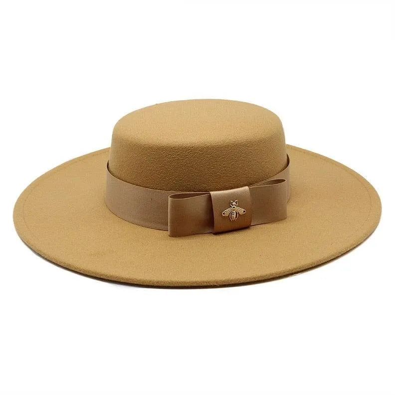 Camel flat top fedora hat for women with French bowknot and gold bee brooch accent