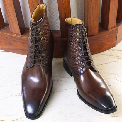 Men's brown leather ankle boots with textured upper, lace-up style on marble floor