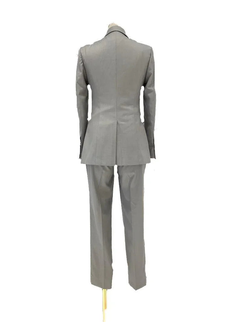 Back view of grey women's three-piece pantsuit with blazer and trousers on mannequin