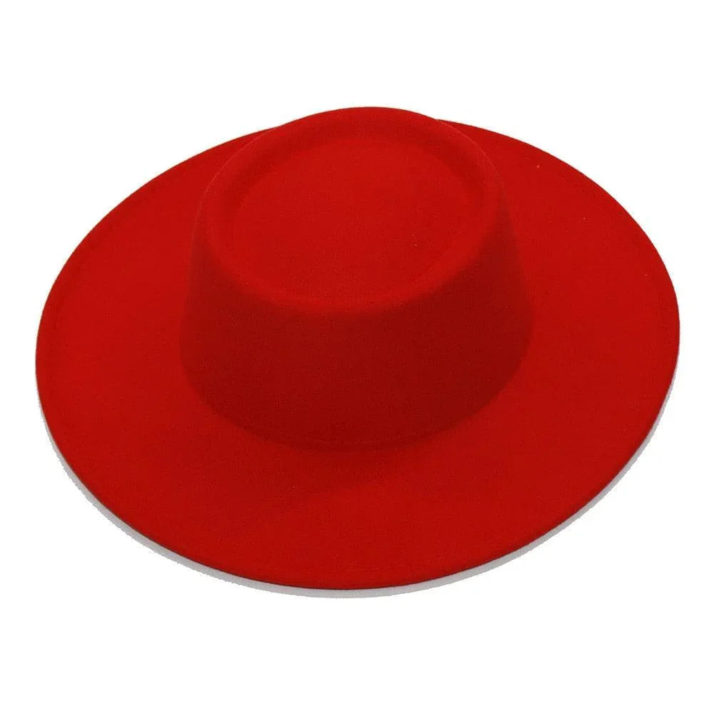 Bold red fedora hat with wide brim on a white background