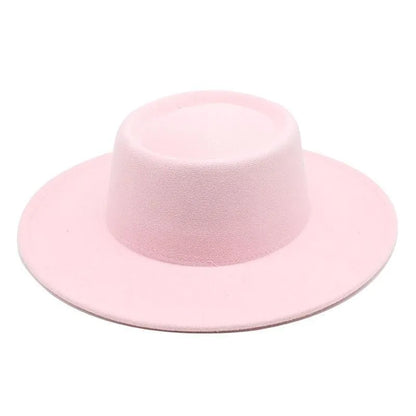 Light pink felt fedora hat with wide brim on a white background