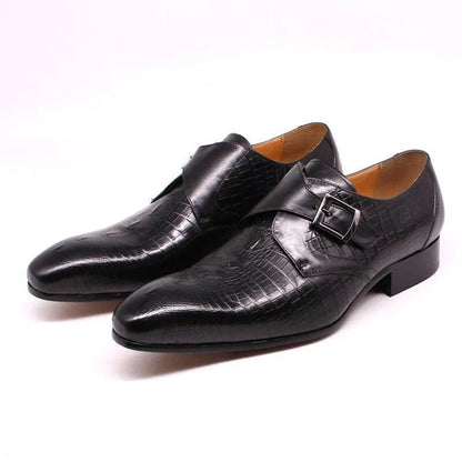 Men's black leather dress shoes with buckle and crocodile pattern on white background