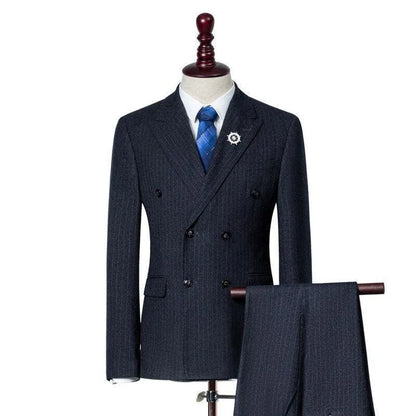 Men's dark grey pinstripe three-piece suit with blue tie on mannequin