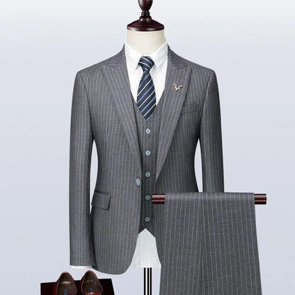 Gray pinstripe men's three-piece suit on mannequin with tie and dress shoes