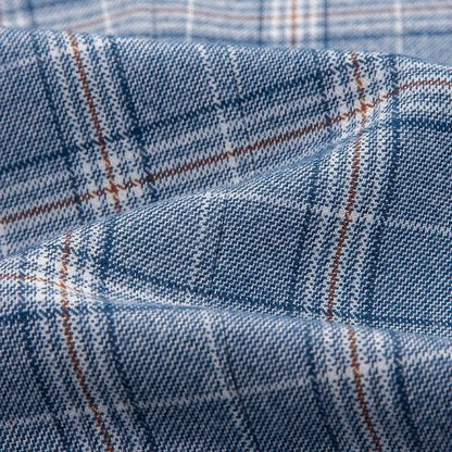 Blue grey plaid suit fabric with white and brown lines, close-up texture view