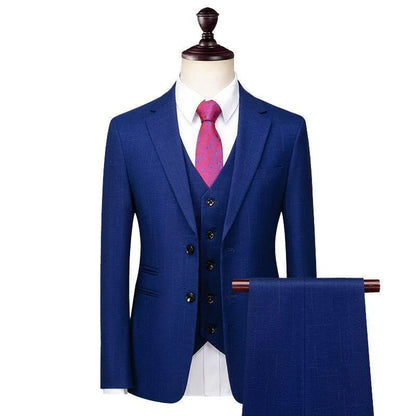 Men's blue 3-piece suit with red tie on mannequin, formal wear display