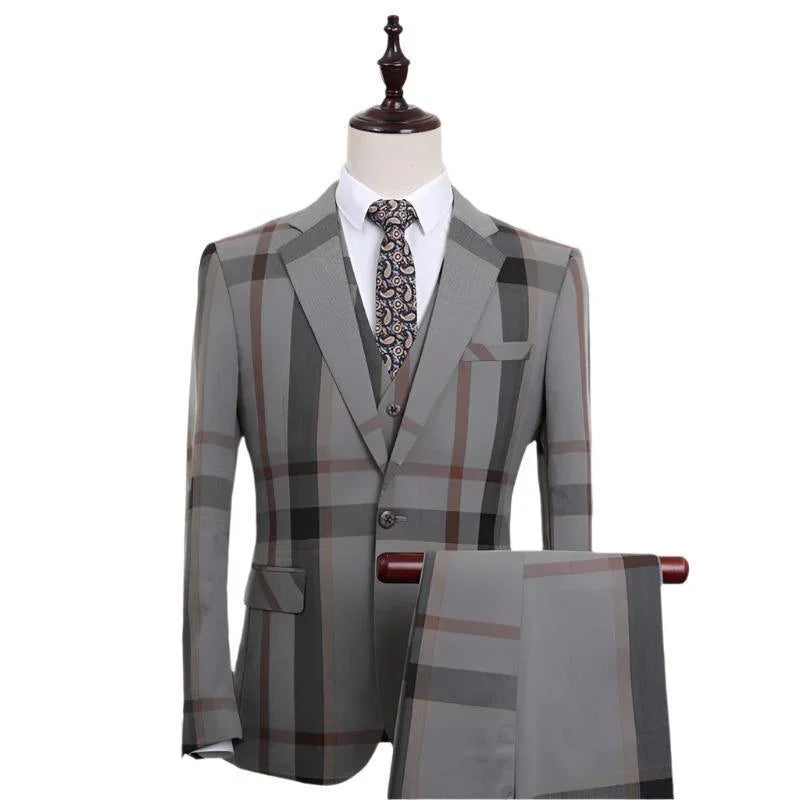 Men's plaid three-piece suit in grey with windowpane pattern on mannequin