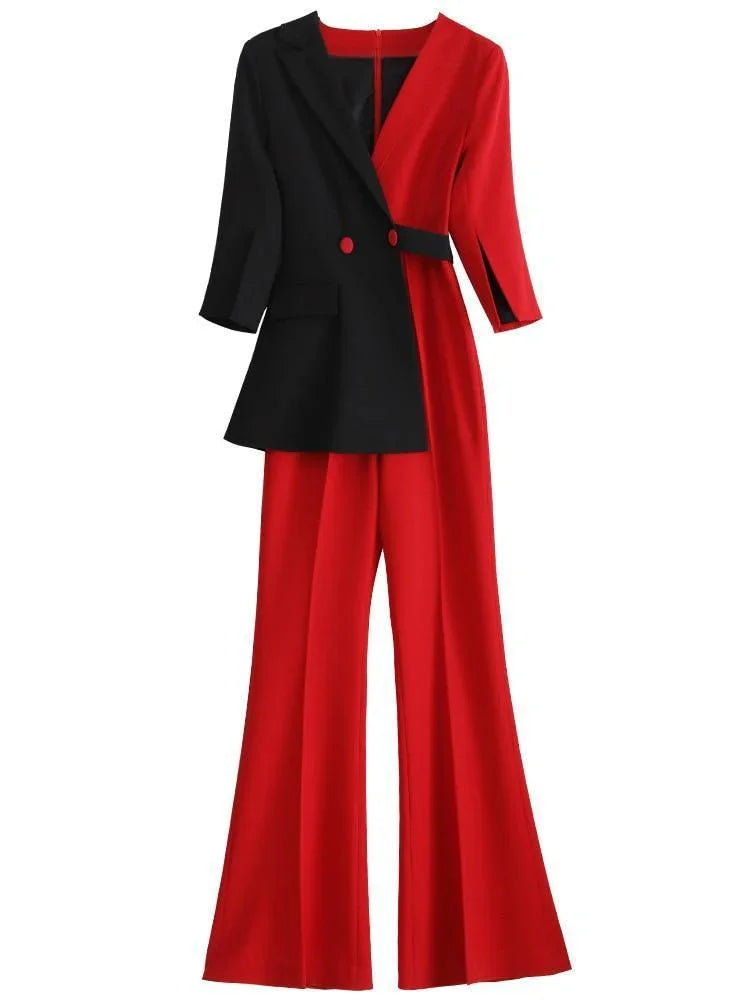 Red and black pantsuit with detachable veil, wide-leg trousers, and asymmetrical blazer.